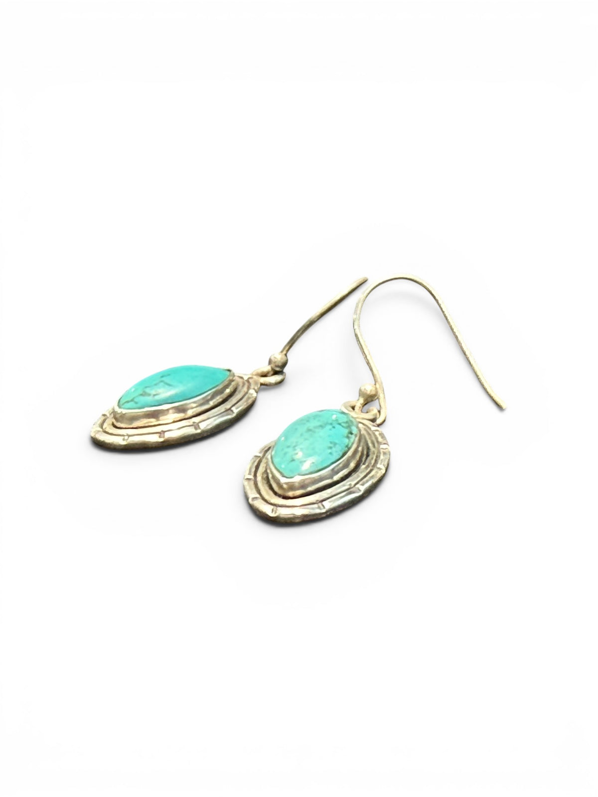 Our southwest earrings are made from Arizona turquoise set in wide sterling silver mounts. Length 4 cm including hook