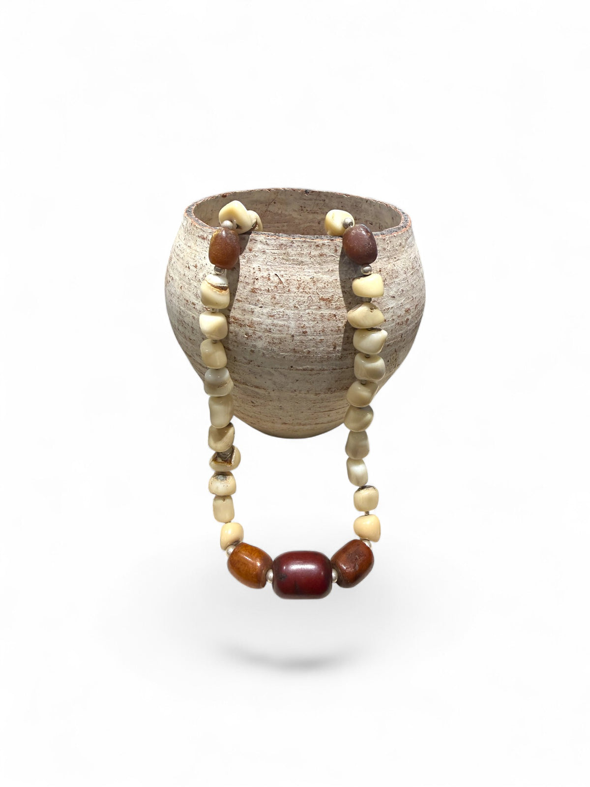 White coral & amber long necklace. Natural bamboo coral, antique amber & Bakelite prayer beads from Afghanistan, highlighted with sterling silver. Length 65.5
