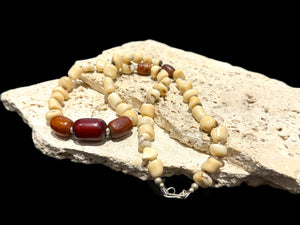 White coral & amber long necklace. Natural bamboo coral, antique amber & Bakelite prayer beads from Afghanistan, highlighted with sterling silver. Length 65.5