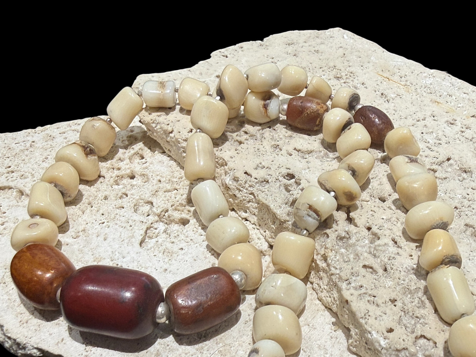 White coral & amber long necklace. Natural bamboo coral, antique amber & Bakelite prayer beads from Afghanistan, highlighted with sterling silver. Length 65.5