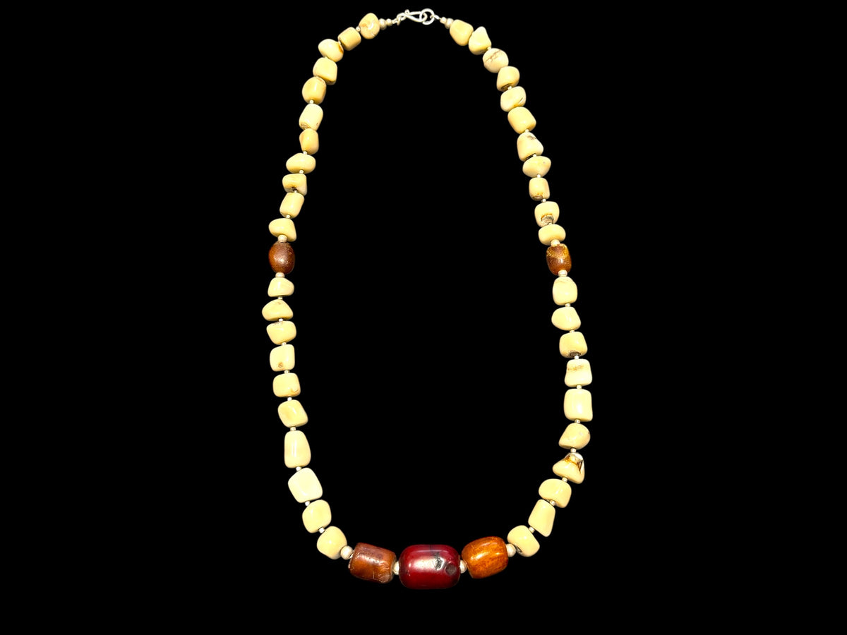 White coral & amber long necklace. Natural bamboo coral, antique amber & Bakelite prayer beads from Afghanistan, highlighted with sterling silver. Length 65.5