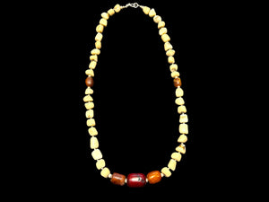 White coral & amber long necklace. Natural bamboo coral, antique amber & Bakelite prayer beads from Afghanistan, highlighted with sterling silver. Length 65.5