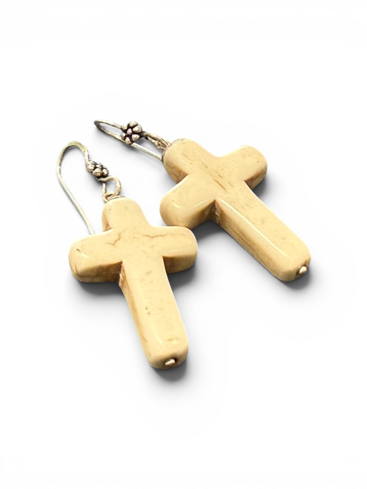 Bold Southwest crucifix earrings are hand crafted from natural creamy white howlite stone, finished with a handmade sterling silver rosette shepard hook. Height including hook 5 cm