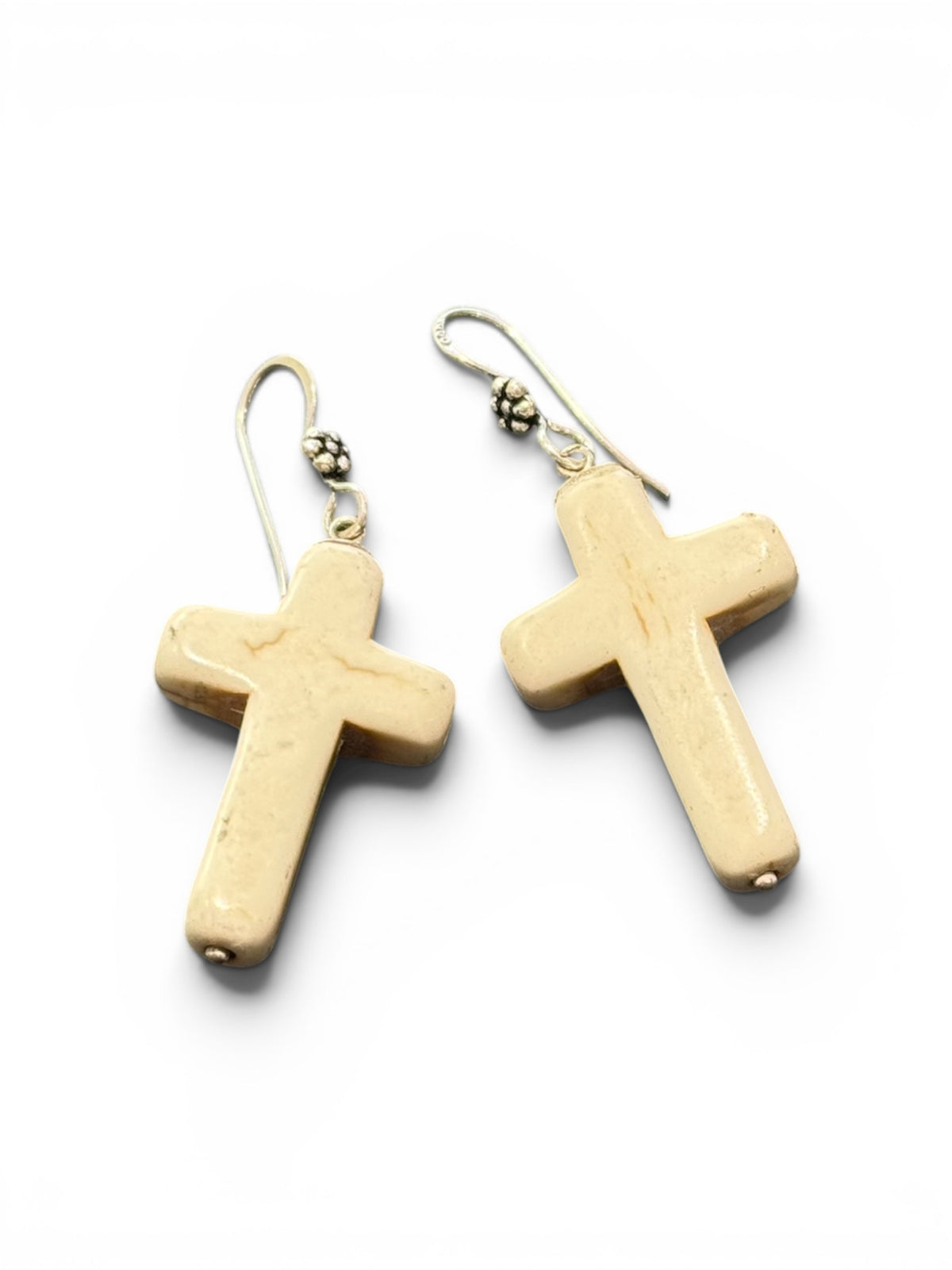 Bold Southwest crucifix earrings are hand crafted from natural creamy white howlite stone, finished with a handmade sterling silver rosette shepard hook. Height including hook 5 cm