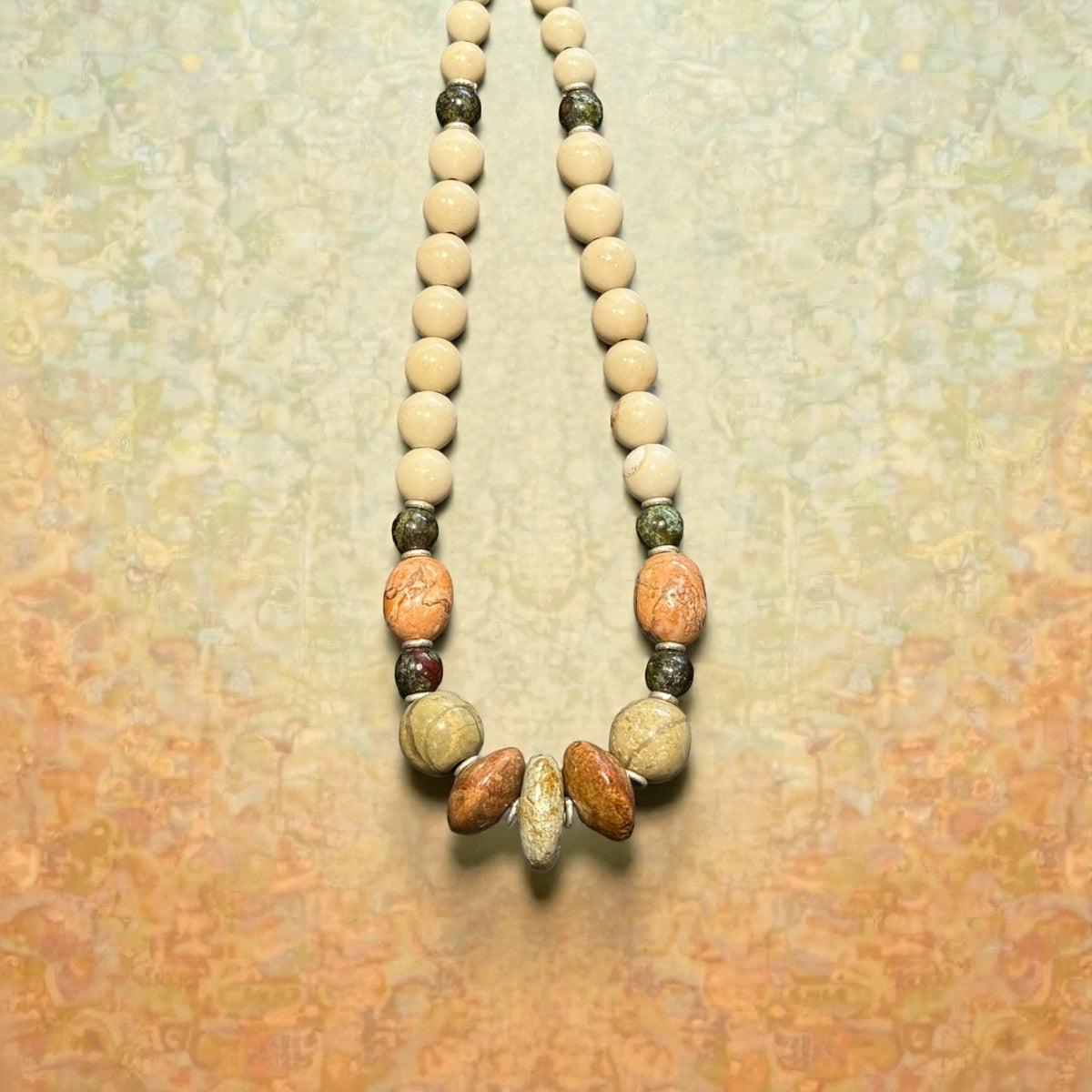 Tribally inspired, pastel toned stone necklace featuring pale turquoise, bloodstone, jasper and sterling silver.  Length 50 cm
