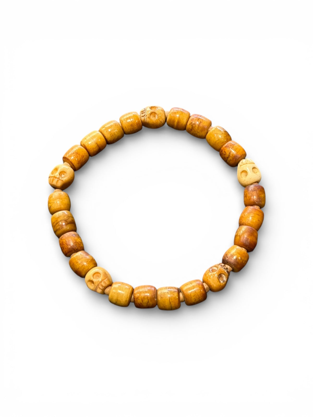 Carved vintage yak bone bead bracelet features carved skull beads and tiny sandalwood spacer beads. Stretchy cord, wear alone or stacked with other bracelets. Two sizes, 20 cm and 18 cm. Unisex bracelet for men or women.