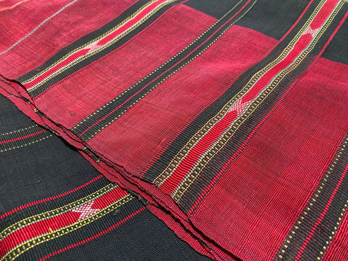 Waziri men's shawl or chador, Northwest Frontier Pakistan/Afghanistan. Hand loomed in two pieces sewn together. Dark indigo/black cotton body is woven with red silk and a stripped patterned border as contrast. Early 20th C, most likely an heirloom piece used only once. In superb condition without blemish. 231 x 134 cm
