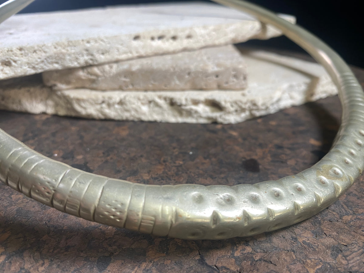 Solid cast & chiselled hansuli torque. rural Gujarat, India. Coin silver. 19th century. Width 16 cm, width at opening 7 cm. Weight 260 g