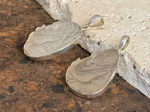 Hand carved clear quartz pendants depicting Ganesh. These are unique pieces with a beautiful clarity. Sterling silver frames and bails.  These unisex quartz pendants will suit both men and women.