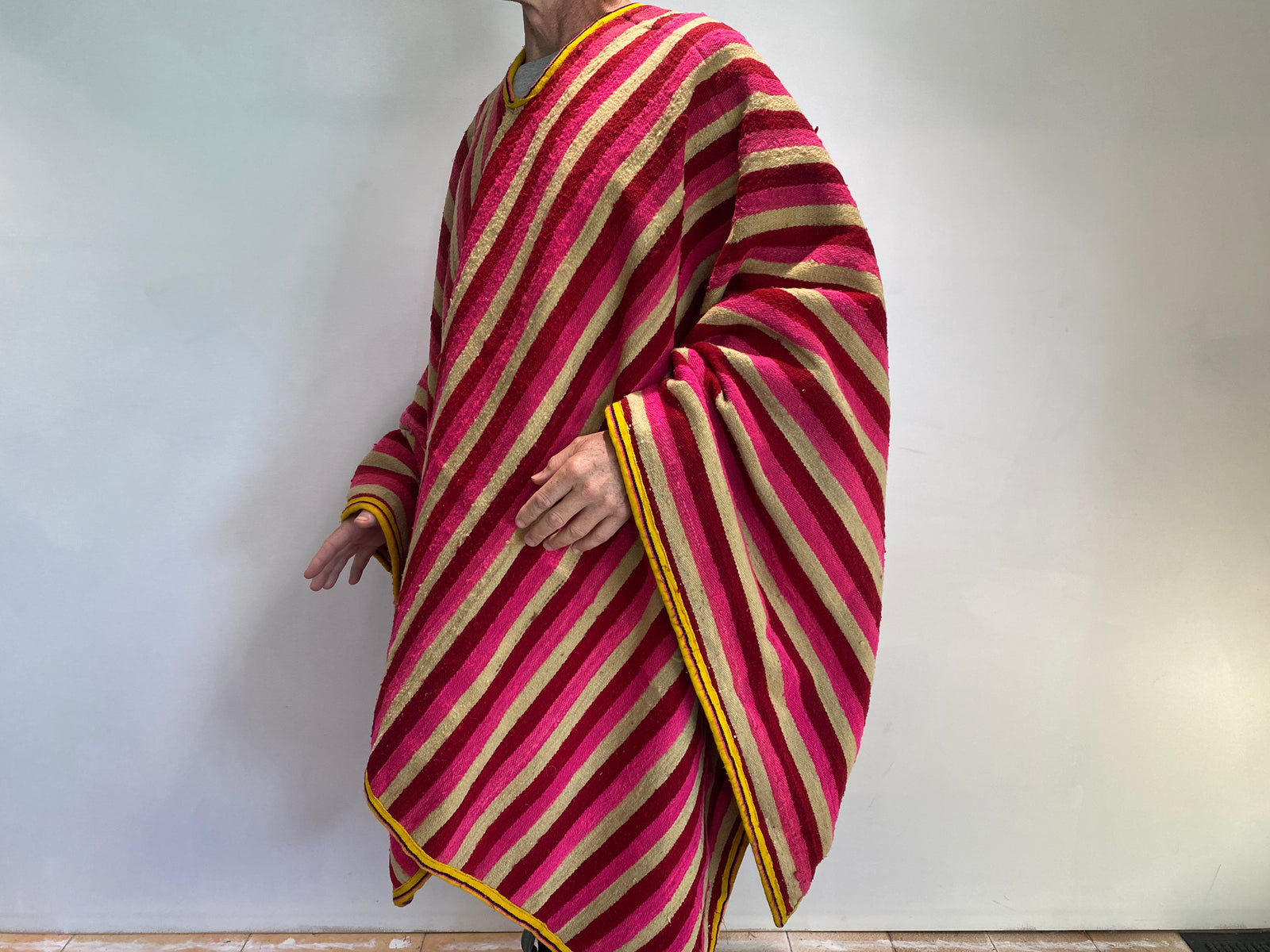 Traditional Ecuadorian men's alpaca wool blanket poncho. Circa 1960. From the Andes Mountains, Ecuador. Featuring a very heavy aguayo traditional weave with cotton border. Typically worn by cowboys in Ecuador. Measurements: width 170 x length 176 cm. Neck opening 29 cm.