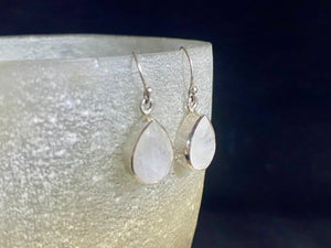 Teardrop rainbow moonstone earrings feature facet cut rainbow moonstones and are finished with sterling silver surrounds and very generous shepherd hooks.  Measurements: height 3 mm (0.12 in) including hook, width at base 6 mm