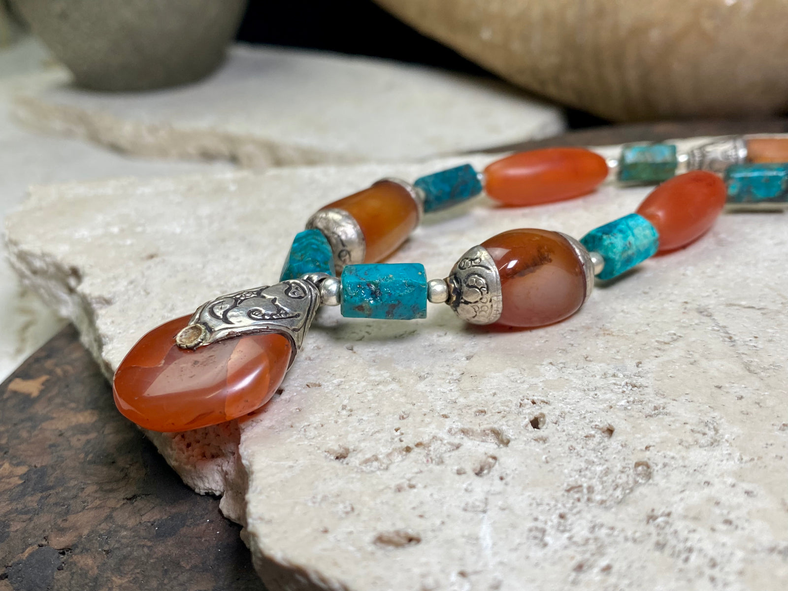 Antique Tibetan fluted carnelian beads are matched with silver capped carnelian beads and chrysocolla to give this necklace a lovely antique feel. Length 47 cm, pendant height 3.5 x width 2.2 cm