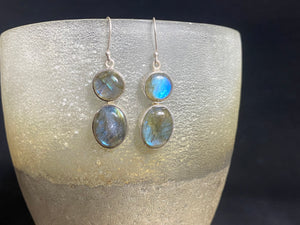 Large, oval labradorite earrings, crafted from cabochon labradorite stones set in sterling silver and finished with large hooks. Measurements: height 4.8 cm x width 1.2 cm