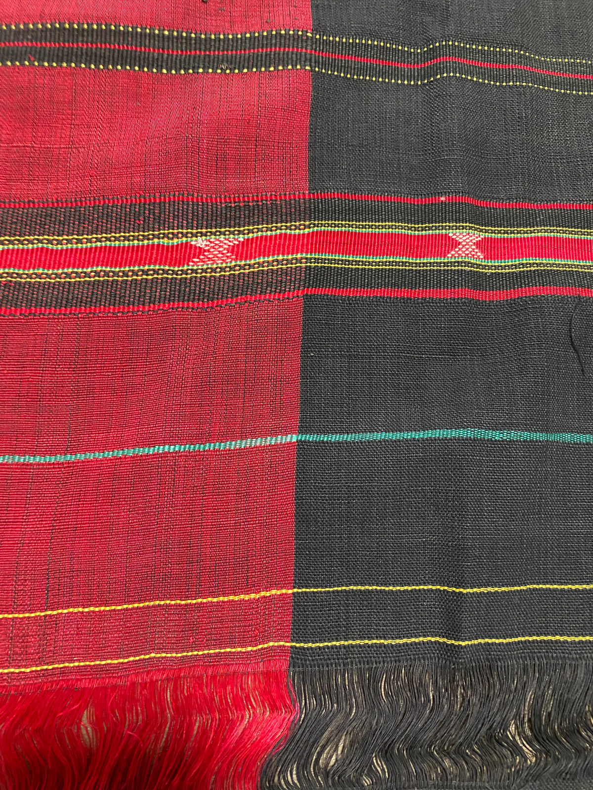 Waziri men's shawl or chador, Northwest Frontier Pakistan/Afghanistan. Hand loomed in two pieces sewn together. Dark indigo/black cotton body is woven with red silk and a stripped patterned border as contrast. Early 20th C, most likely an heirloom piece used only once. In superb condition without blemish. 231 x 134 cm