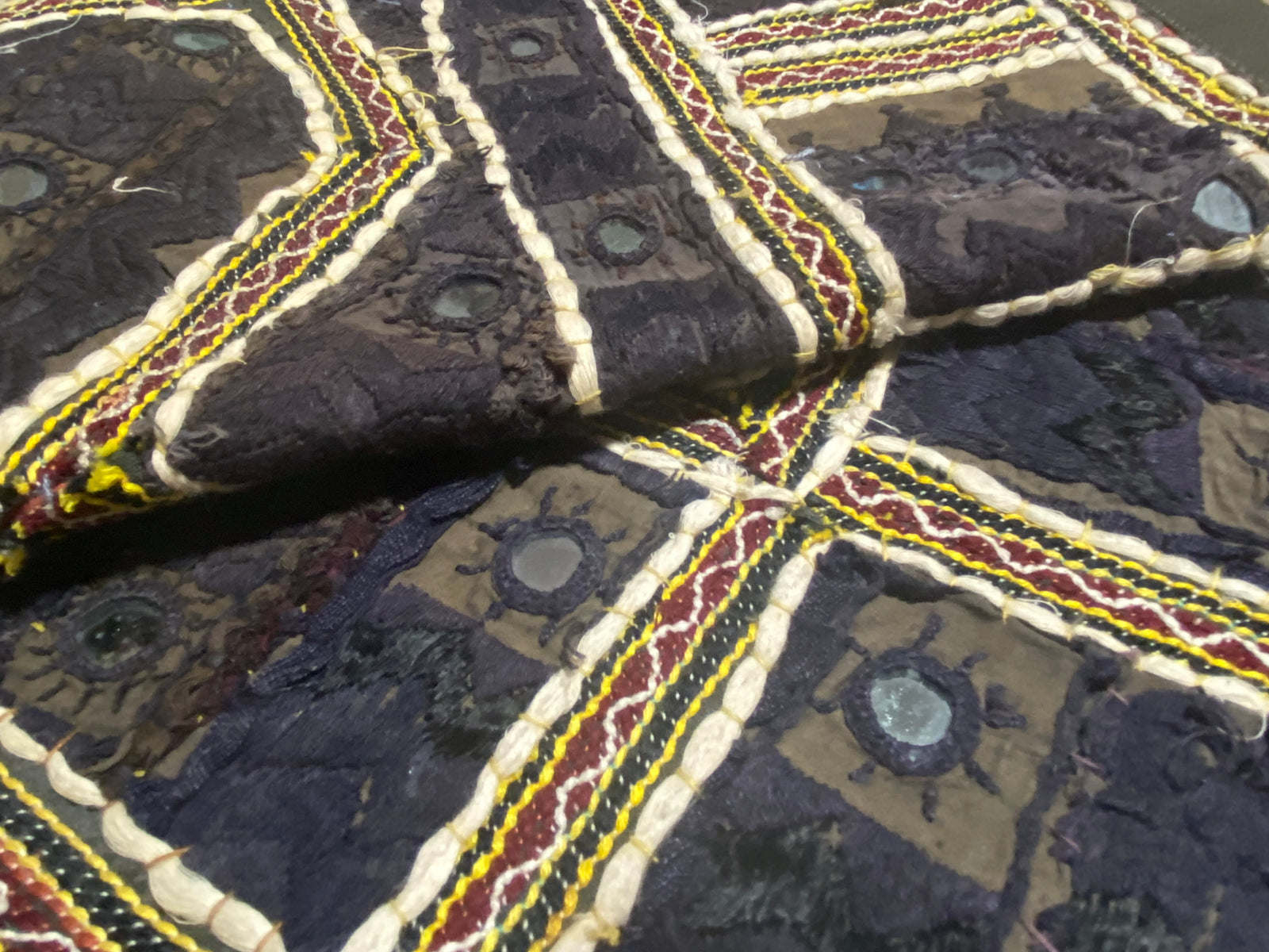 Authentic vintage Rabari textile featuring mirror-work, hand embroidery, applique and silver metal thread zari work. Mid 20th Century, from the Sind Desert region of Rajasthan. The textile is in excellent condition apart from some nibbles to the side of the textile. Measurements: 136 x 170 cm