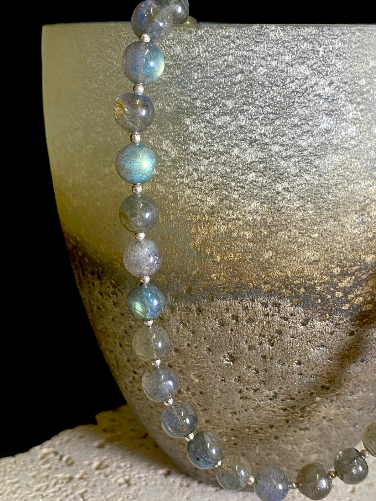 Beautiful labradorite necklace made from round labradorite beads highlighted with fine sterling silver beads designed to highlight the iridescent quality of the stone. Our necklace is strung on premium stringing material and is finished with a sterling silver hook clasp and findings. Measurements: length 43 cm (16.8")