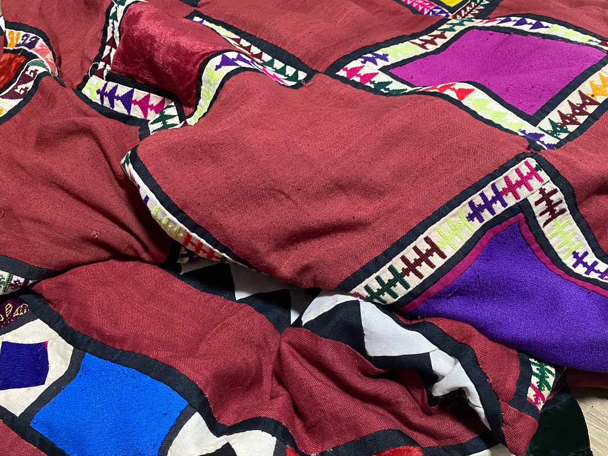 Uzbeki Afghani korak patchwork. Geometric patchwork of cotton, silk, velvet & embroidered fabric squares, framed with embroidery. Traditionally used by nomads as coverlets or wall hangings in their tents. Protects against evil eye. This is a fine example of this style of workmanship. Early 20th C: 200 x 173 cm