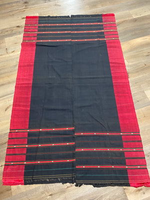 Waziri men's shawl or chador, Northwest Frontier Pakistan/Afghanistan. Hand loomed in two pieces sewn together. Dark indigo/black cotton body is woven with red silk and a stripped patterned border as contrast. Early 20th C, most likely an heirloom piece used only once. In superb condition without blemish. 231 x 134 cm