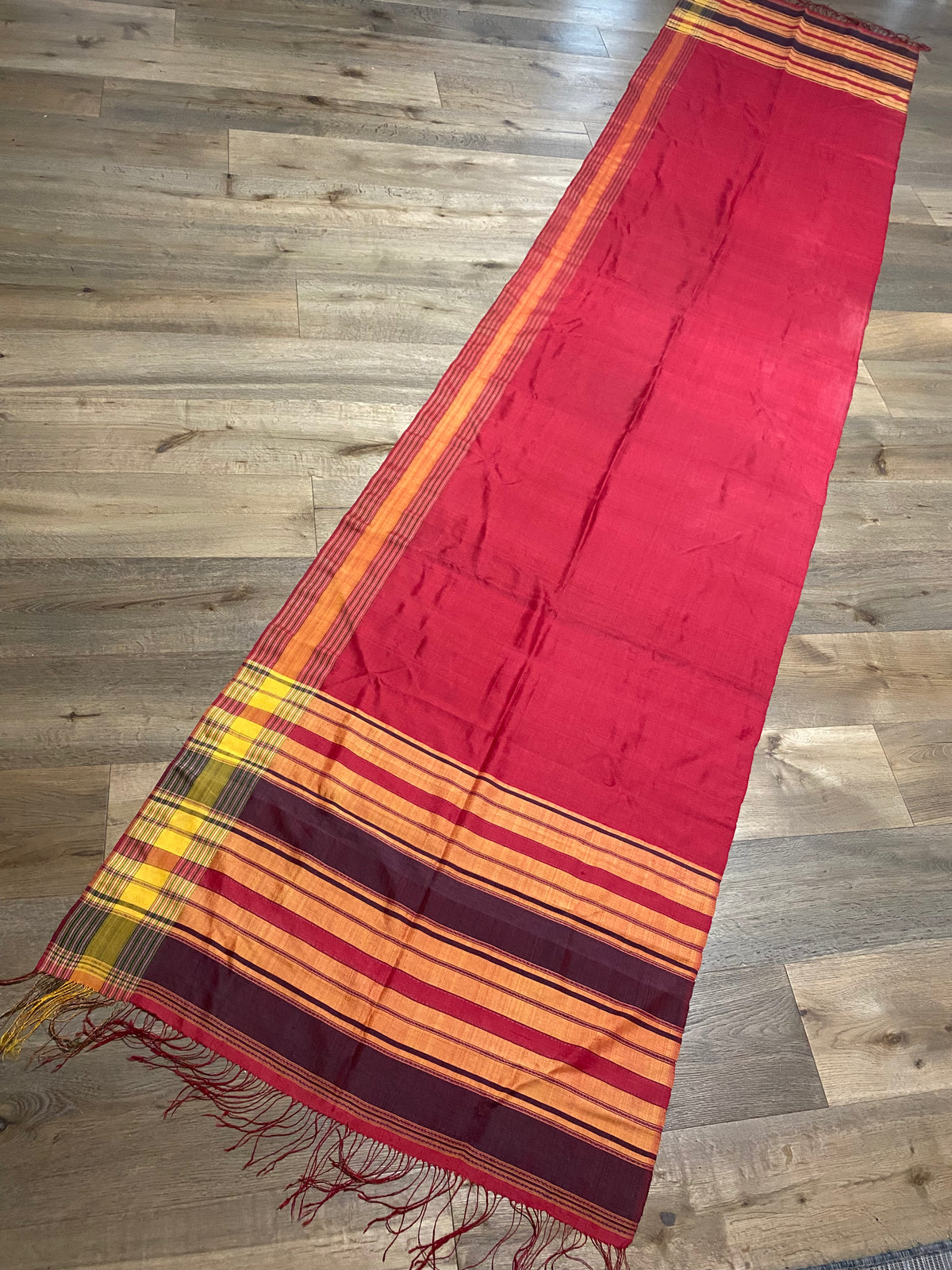 Rare classic example of a balanced tabby-weave silk shawl from Turkmenistan. Silk, terminating in fringed ends. This shawl is new, but was collected by my father in the 1990's and to our knowledge is an heirloom piece, woven in the early 20th century. In superb condition. 373 x 82 cm, not including fringes.