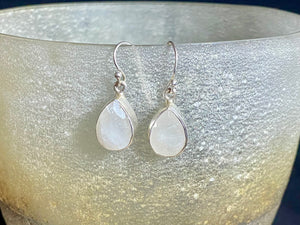 Teardrop rainbow moonstone earrings feature facet cut rainbow moonstones and are finished with sterling silver surrounds and very generous shepherd hooks.  Measurements: height 3 mm (0.12 in) including hook, width at base 6 mm