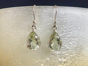 Elegant teardrop green amethyst earrings featuring facet cut gem quality stones. Open at the back to allow the natural light and beauty of the amethysts to shine through. Size 3.2 cm length including hook.