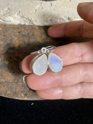 Teardrop rainbow moonstone earrings feature facet cut rainbow moonstones and are finished with sterling silver surrounds and very generous shepherd hooks.  Measurements: height 3 mm (0.12 in) including hook, width at base 6 mm