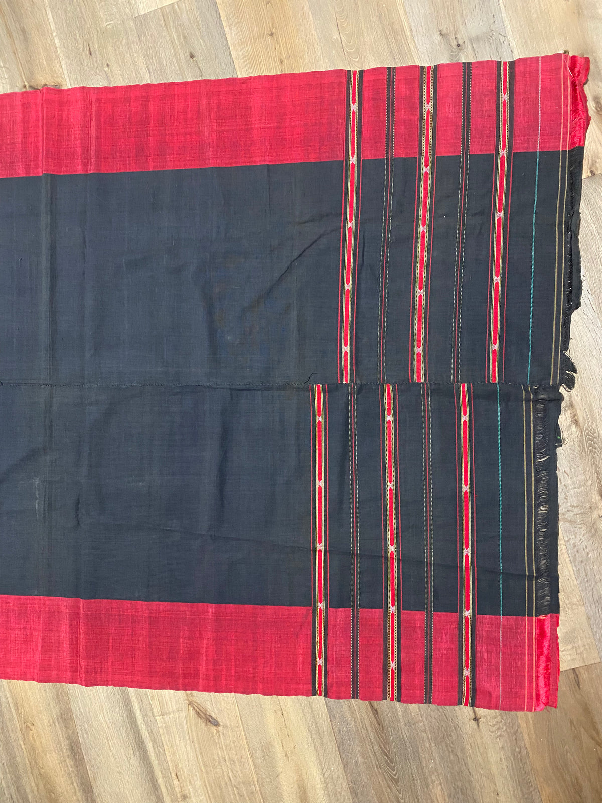 Waziri men's shawl or chador, Northwest Frontier Pakistan/Afghanistan. Hand loomed in two pieces sewn together. Dark indigo/black cotton body is woven with red silk and a stripped patterned border as contrast. Early 20th C, most likely an heirloom piece used only once. In superb condition without blemish. 231 x 134 cm