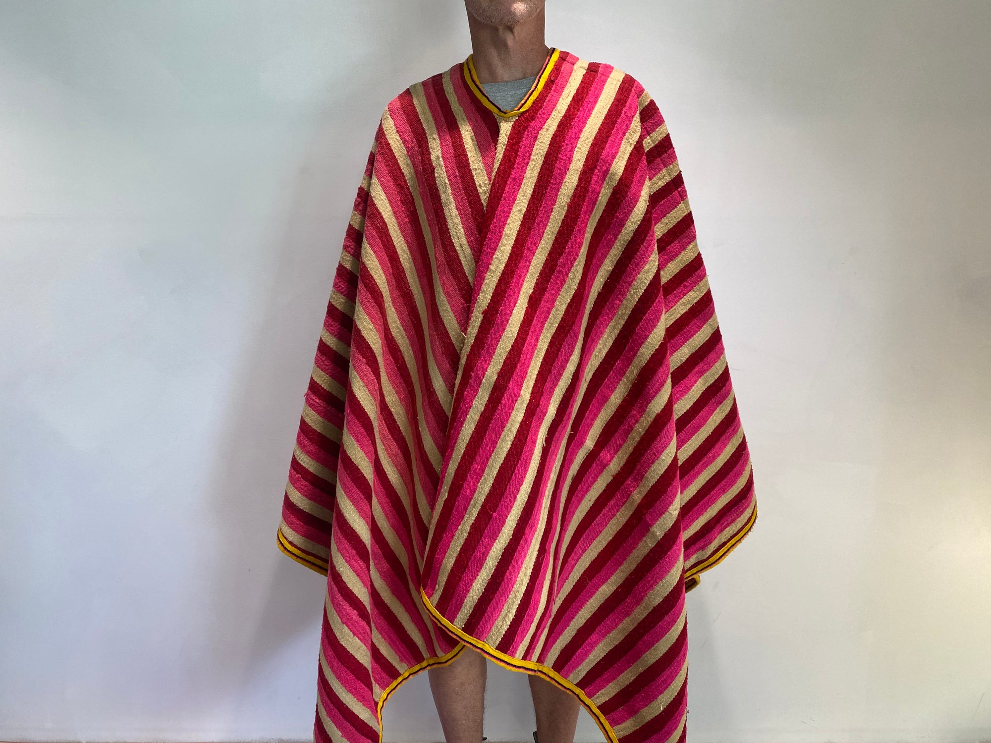 Traditional Ecuadorian men's alpaca wool blanket poncho. Circa 1960. From the Andes Mountains, Ecuador. Featuring a very heavy aguayo traditional weave with cotton border. Typically worn by cowboys in Ecuador. Measurements: width 170 x length 176 cm. Neck opening 29 cm.
