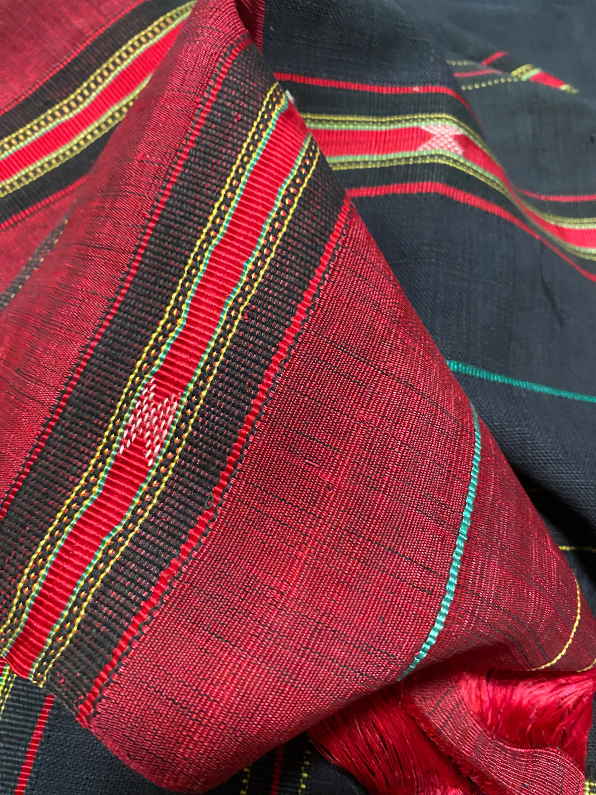 Waziri men's shawl or chador, Northwest Frontier Pakistan/Afghanistan. Hand loomed in two pieces sewn together. Dark indigo/black cotton body is woven with red silk and a stripped patterned border as contrast. Early 20th C, most likely an heirloom piece used only once. In superb condition without blemish. 231 x 134 cm