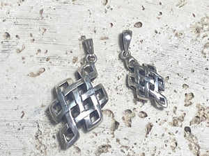 Striking silver Endless Knot pendants, one of the eight auspicious symbols of Buddhism. Sterling silver, in two sizes, from Nepal