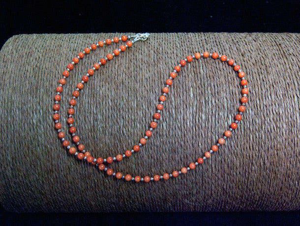 fine red coral bead necklace finished with sterling silver