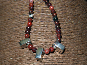 Red jasper necklace with three silver pendants and silver clasp