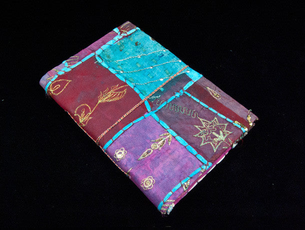 Eco-friendly sari cover journal notebooks are filled with creamy white, handmade recycled notebook paper and are covered in a patchwork of old cotton sari textiles, all finished with cotton, thread and sequin detailing. Three sizes