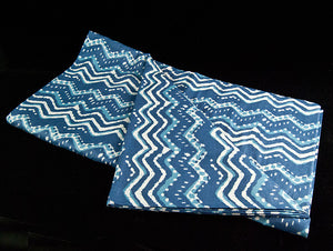  Block printed organic cotton tablecloth featuring natural indigo dye and a bold white and blue geometric pattern