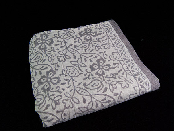  Block printed organic cotton tablecloth featuring natural dyes and an elegant white and grey floral pattern