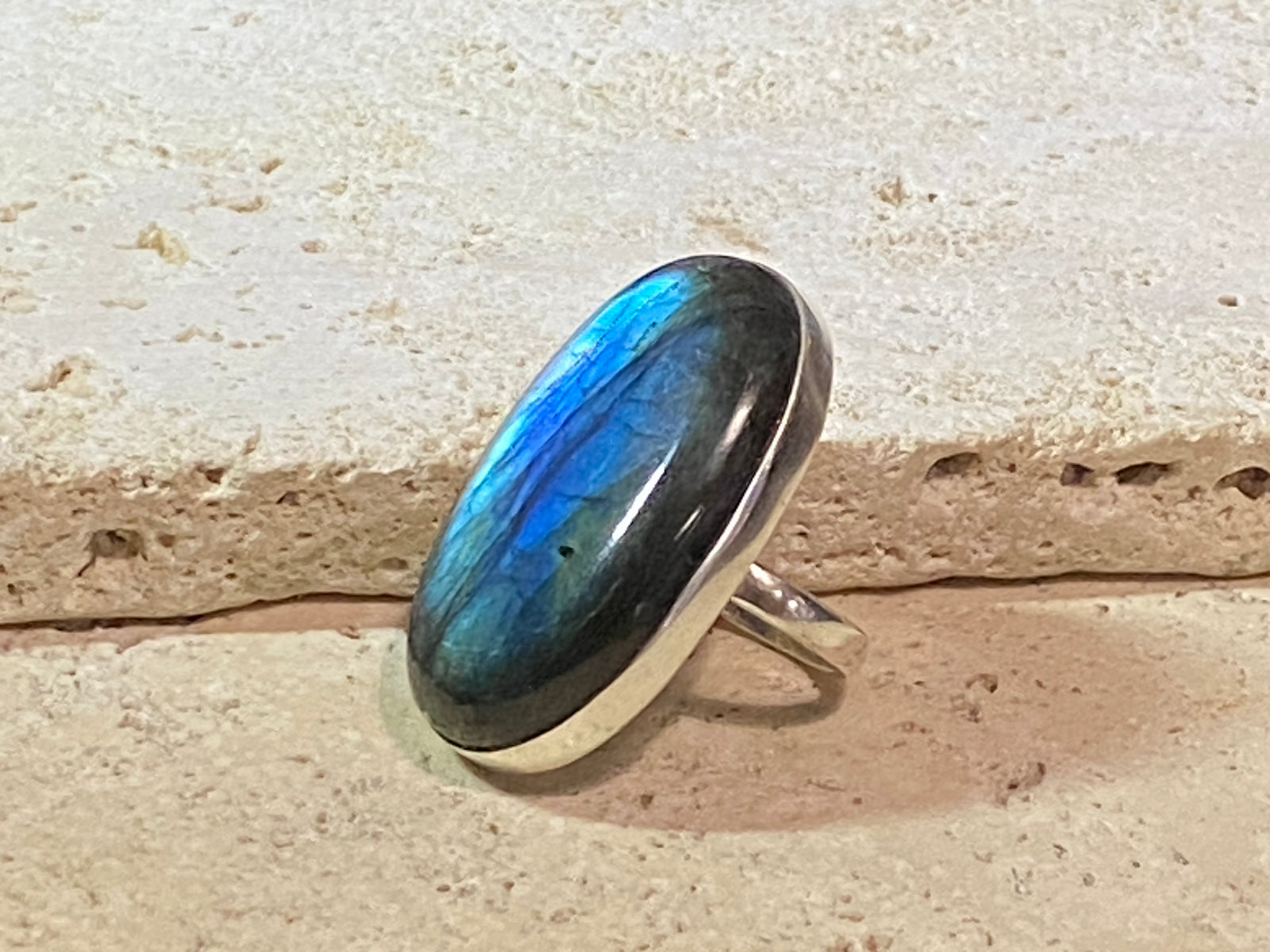 Elegant, large oval cut labradorite ring set in heavy sterling silver. A stunning, high quality stone with excellent fire - one of the best we've ever seen. . Size 7.5