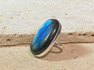 Elegant, large oval cut labradorite ring set in heavy sterling silver. A stunning, high quality stone with excellent fire - one of the best we've ever seen. . Size 7.5
