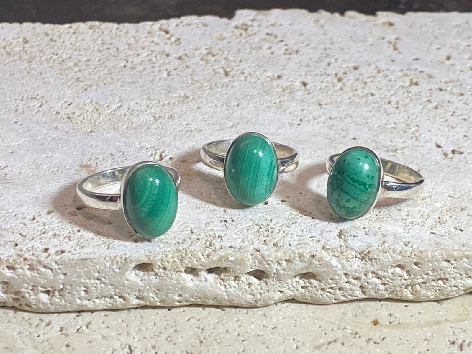 Oval malachite rings set in sterling silver. sizes 7 - 7.5