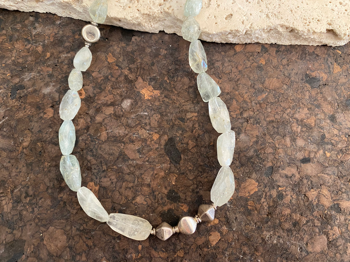 Natural aquamarine bead necklace featuring vintage handmade silver beads. Sterling silver hook and ring clasp findings. 54.1 cm length