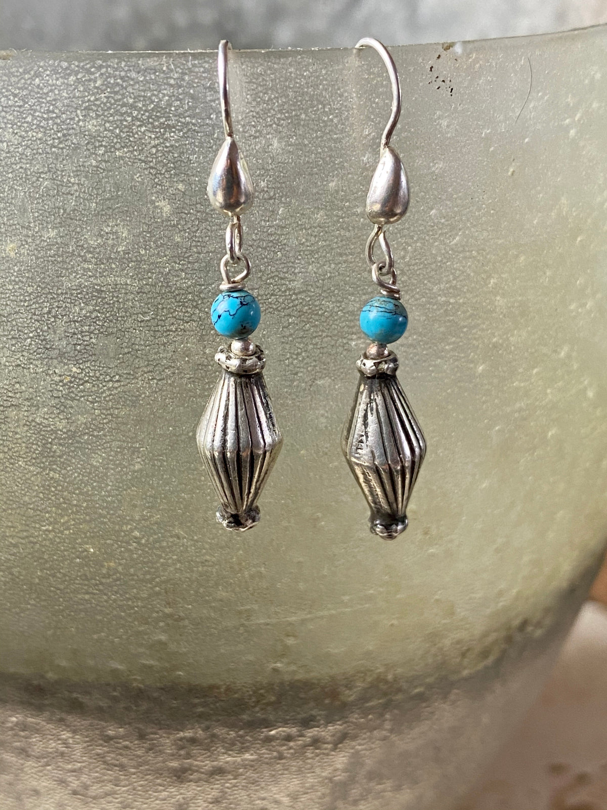 Vintage silver bead from India is teamed up with genuine American turquoise to create a beautiful boho drop earring