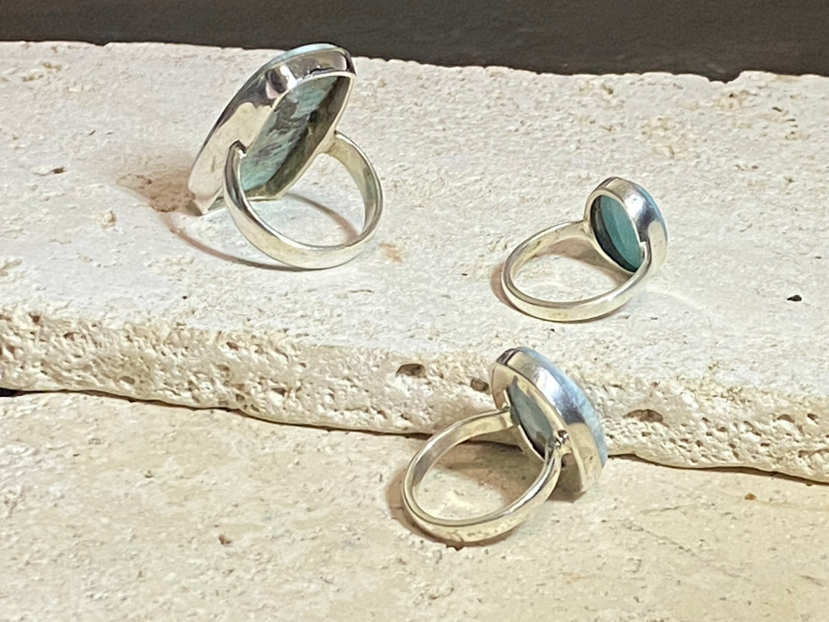 Larimar stone rings set in sterling silver. Each ring is unique, cut and mounted to showcase the beauty of the individual stones.