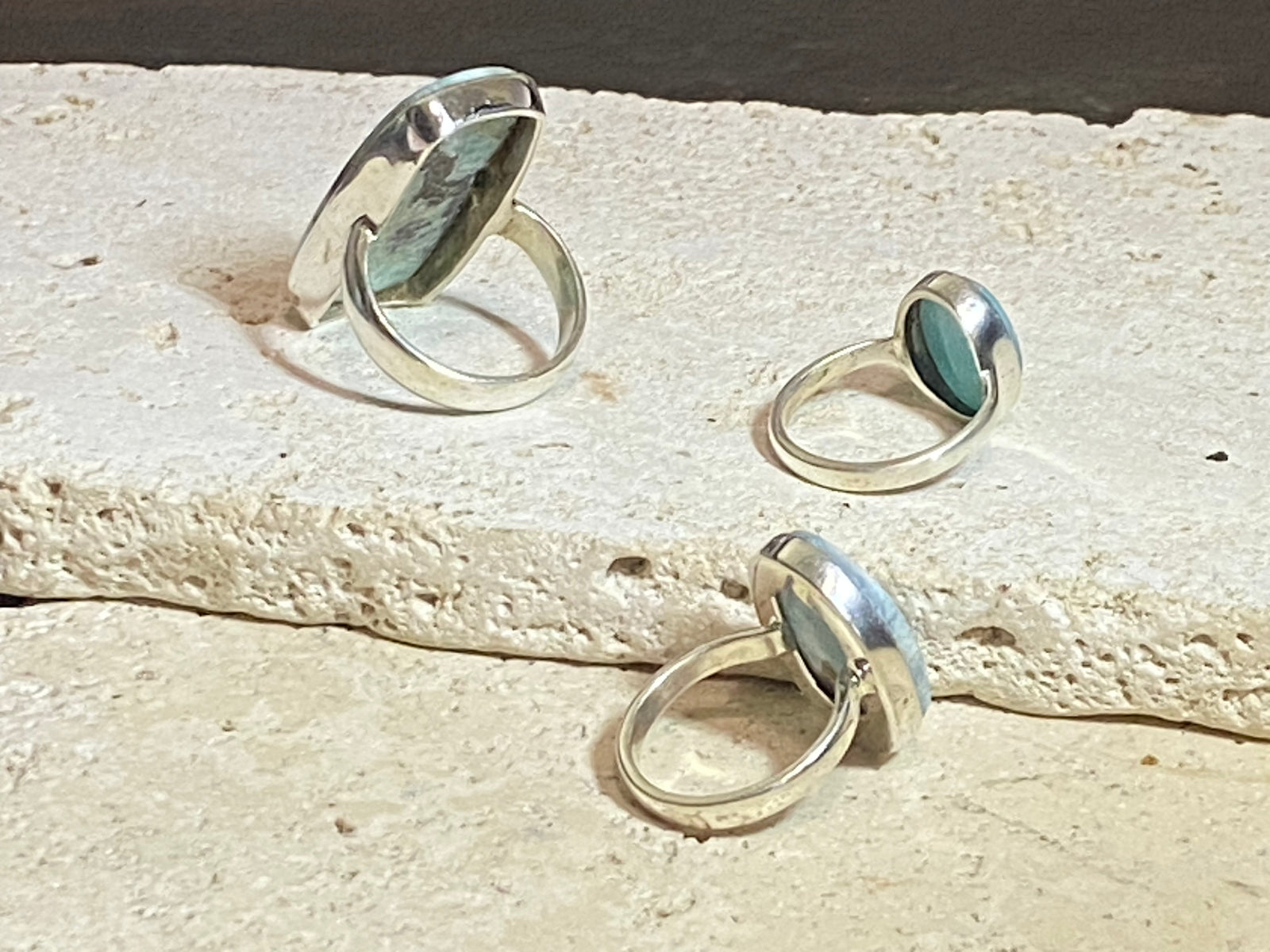 Larimar stone rings set in sterling silver. Each ring is unique, cut and mounted to showcase the beauty of the individual stones.