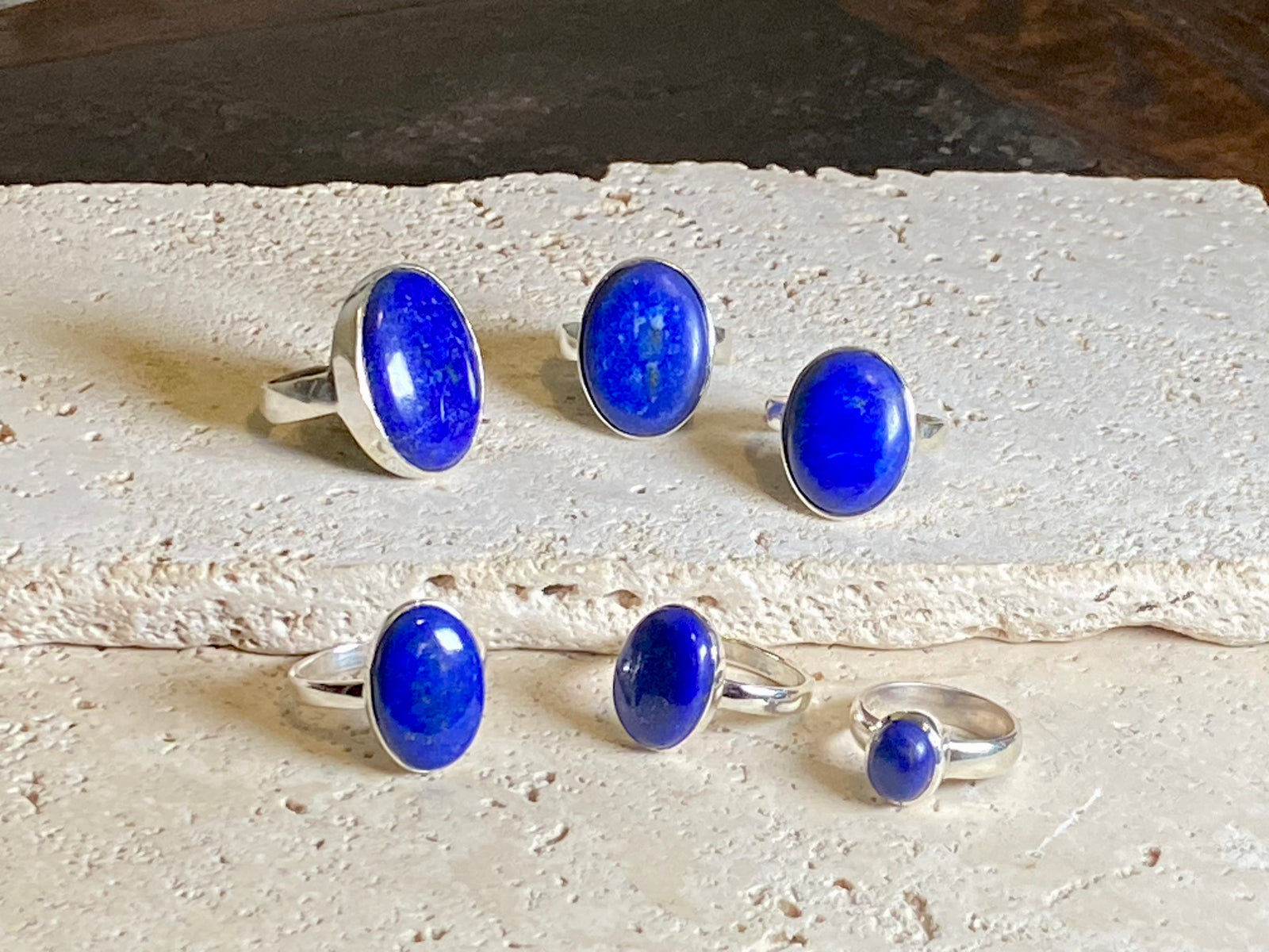 Lapis lazuli stone rings set in sterling silver. Each ring is unique, cut and mounted to showcase the beauty of the individual stones. The lapis is from Afghanistan, completely natural.
