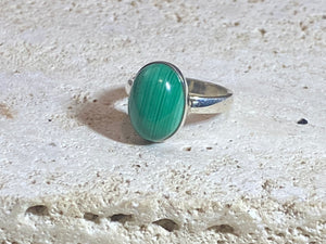 Oval malachite rings set in sterling silver. sizes 7 - 7.5
