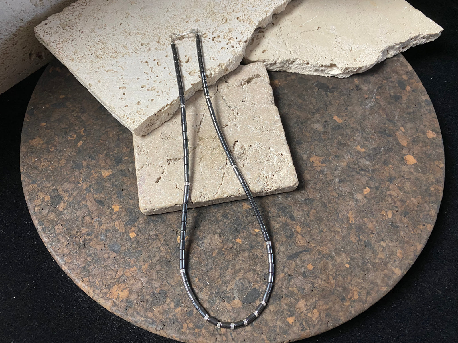 Hematite unisex necklace of tube beads highlighted with sterling silver detailing and finished with a sterling silver hook clasp. Can be worn by men or women.  Natural hematite necklace. Length 44.4 cm (17.5")