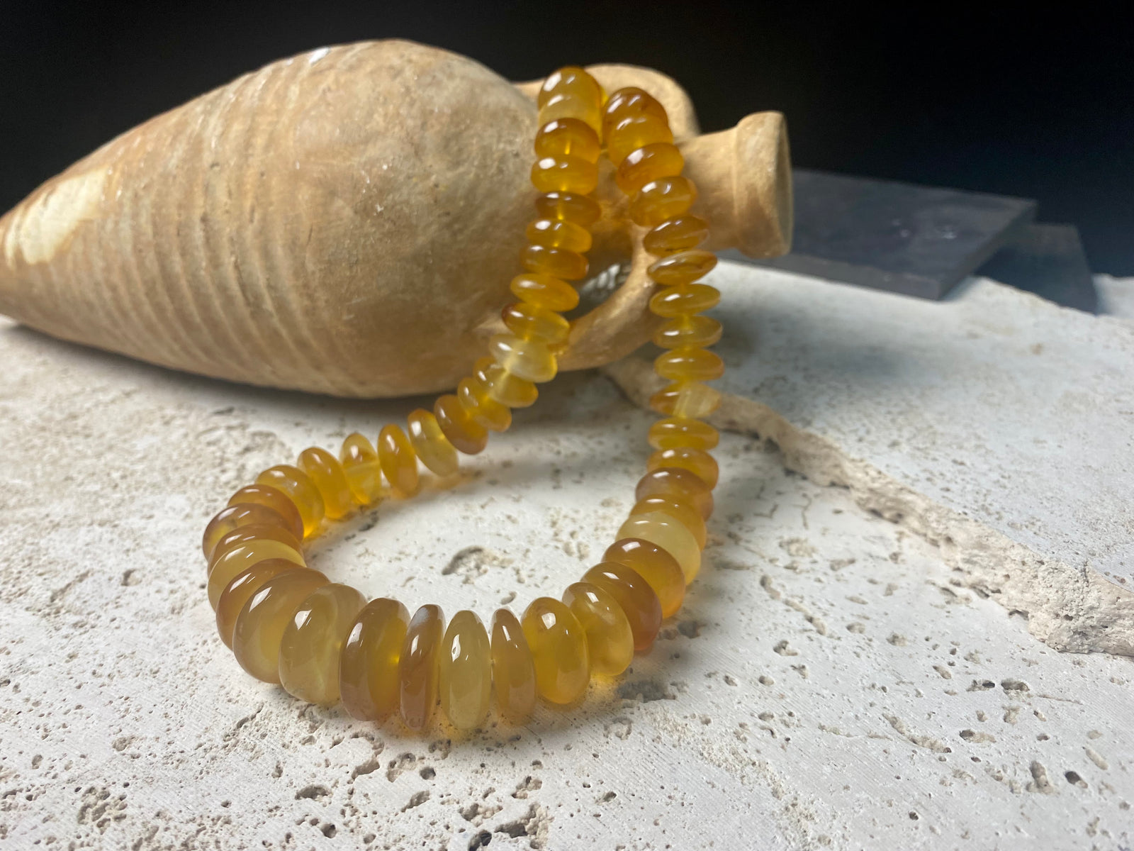 A beautiful necklace of polished graduated caramel onyx beads. Sterling silver clasp and detailing. This statement necklace is designed to impress, with the look of high quality amber without the price tag. length 51.5 cm
