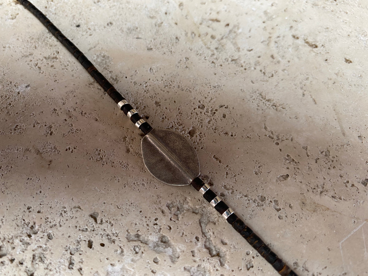 One of our signature coconut silver bracelets, crafted from polished coconut wood and hill tribe 95% silver., with sterling silver lobster clasp. A women's bracelet or a men's bracelet, it has a casual Boho vibe, and is made for that stacked bracelet look. Different sizes available