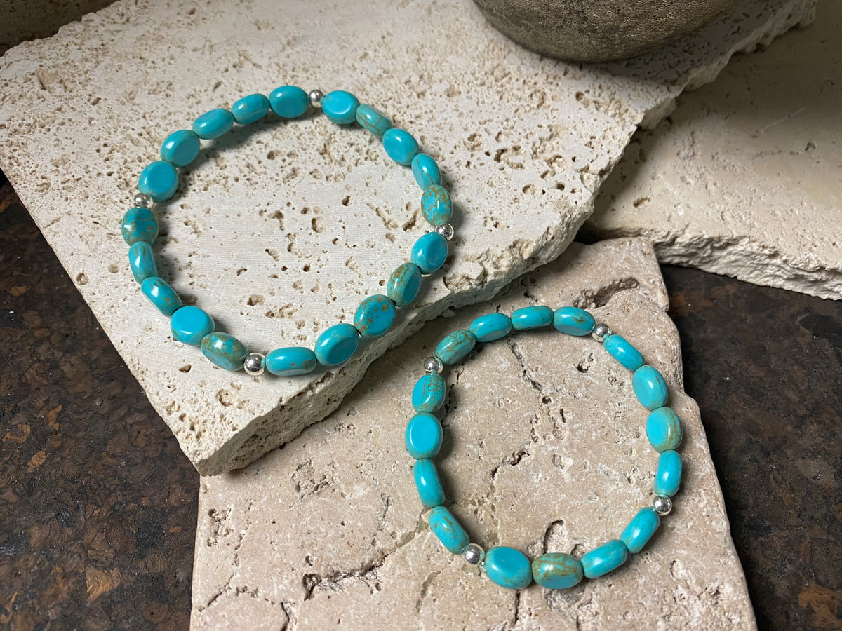 Blue stone bracelet with sterling silver bead detailing. Elasticised stringing for a seamless look.