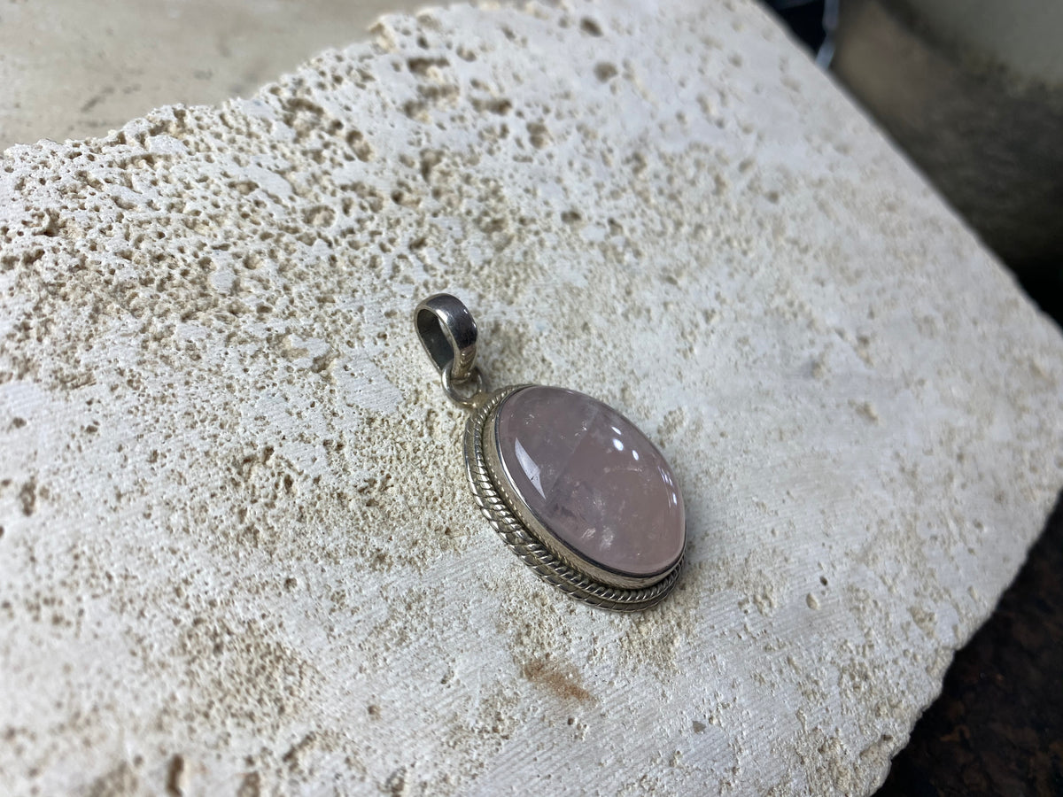 Oval rose quartz and silver pendant