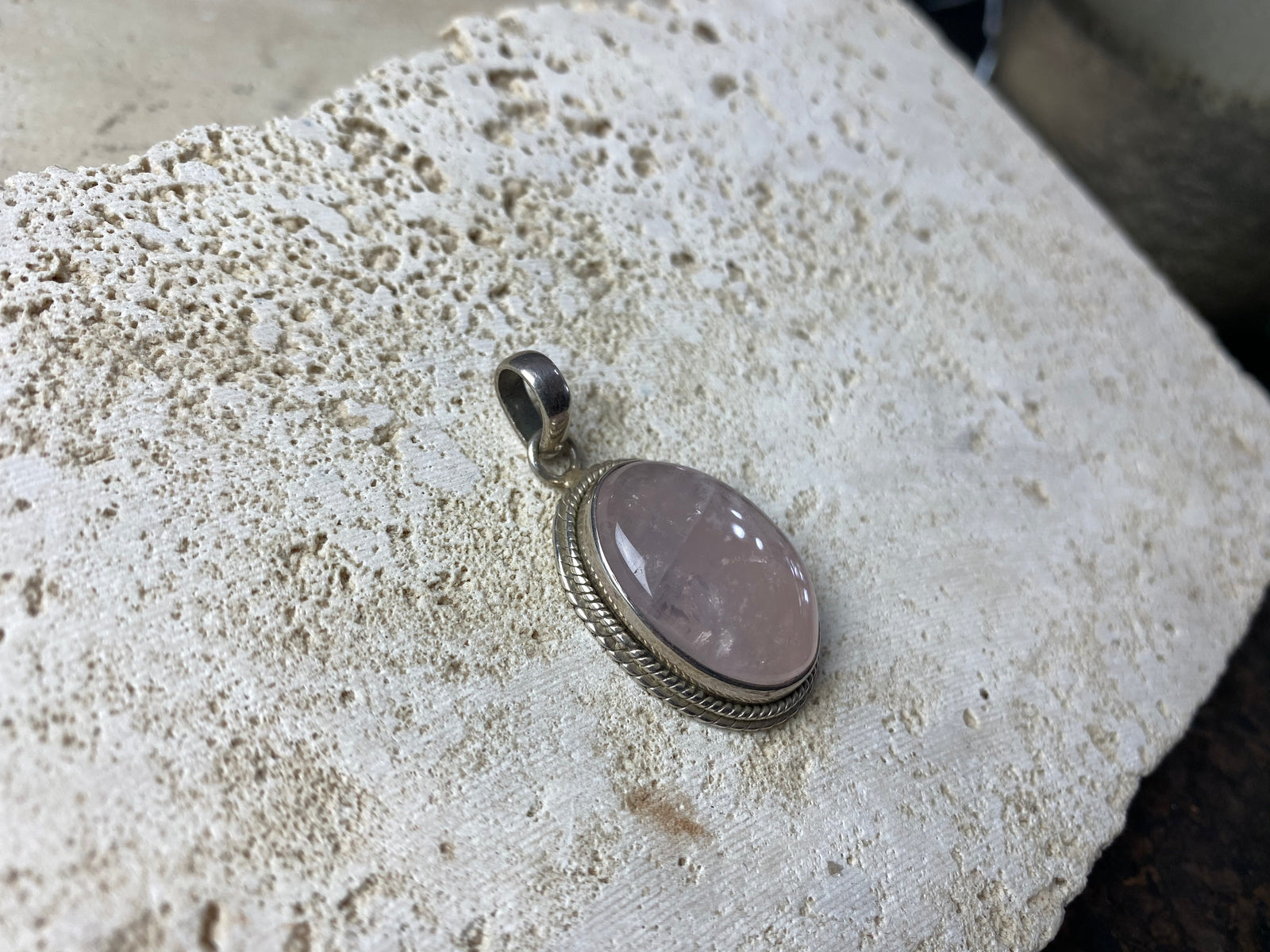 Oval rose quartz and silver pendant